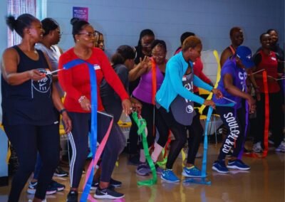 women with ribbons dancing with athletic gear on